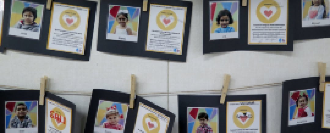 Parents write their commitments to their child, which is posted on classroom walls