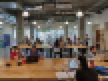 University of Utah students convene in the open-community innovation space on the ground floor of Neeleman Hangar at Lassonde Studios