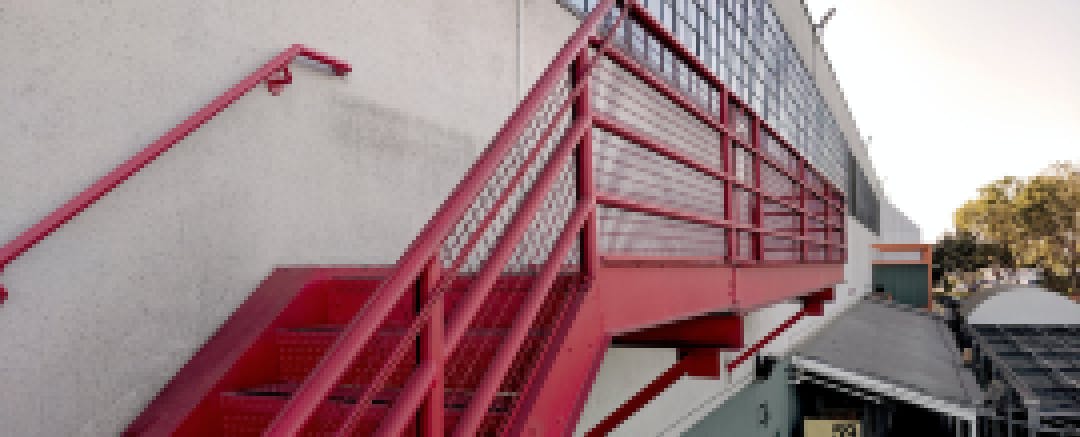 The red stairway leading to Gate 510, which houses this summer’s PilotCity fellows